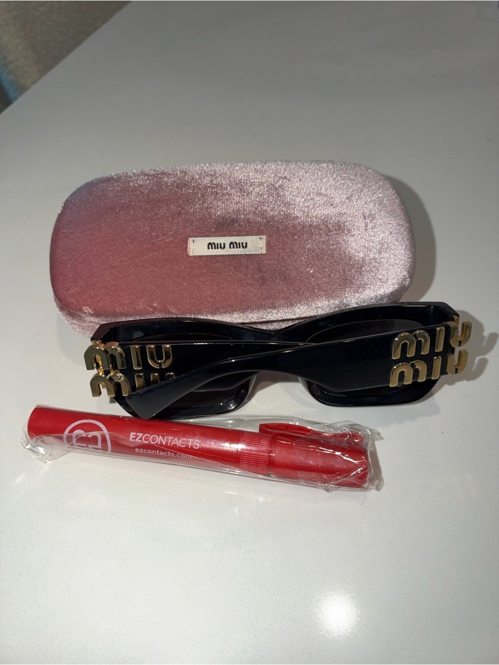 Miu Miu Black Sunglasses with Gold Logo Hardware